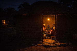 Rural Malawian home lit for the first time using power from a local air-powered generator