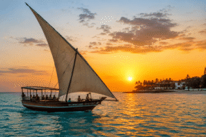 Traditional dhow sailing at sunset in Zanzibar, Tanzania